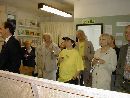 Jeanne Thomas and John Hawkes, wearing the Wandle Valley Festival T-Shirts, listening to the speeches with our MP and others