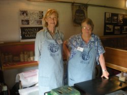 Archivist Alision Cousins with Mary Hart, in the new aprons