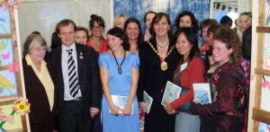 Figure 1 Mary Hart alongside Cllr Martin Whelton with the River and Cloth Team and the Mayor at the exhibition.